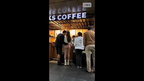 What´s going on here? Is the woman in white angry at what she is seeing, or jealous?