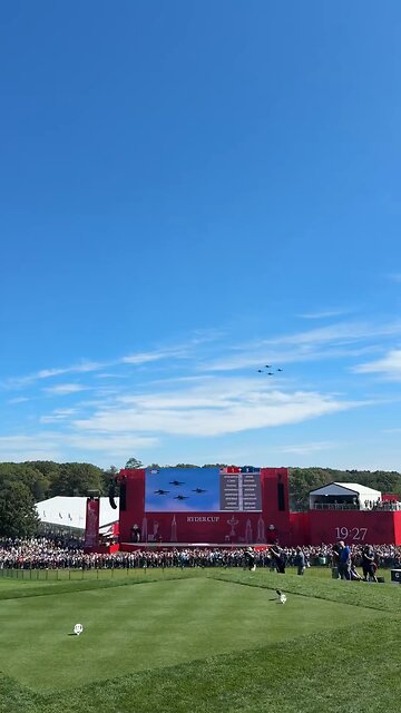 F-18 hornets roar overhead as chants of ‘USA! USA!’ echo through the crowd