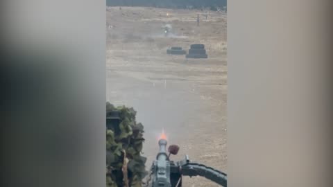 A crew of the Kurier ground robotic system with a 7.62mm PKT machine gun