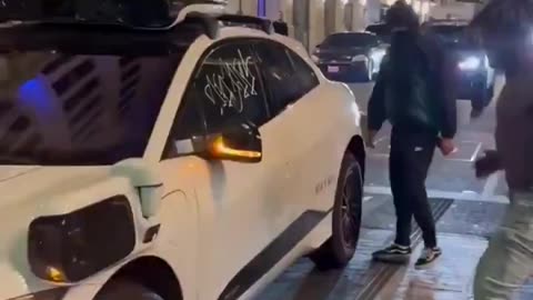 To prove he's a real man, he destroys Google's car.