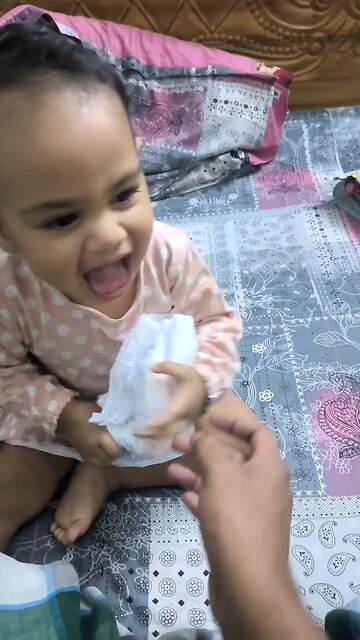 baby joy of moment with her father