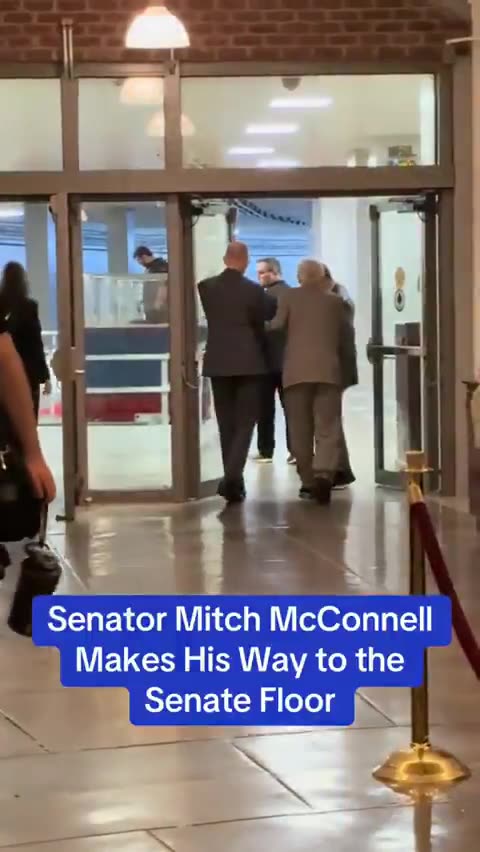 Sen Mitch McConnell led to the Senate floor