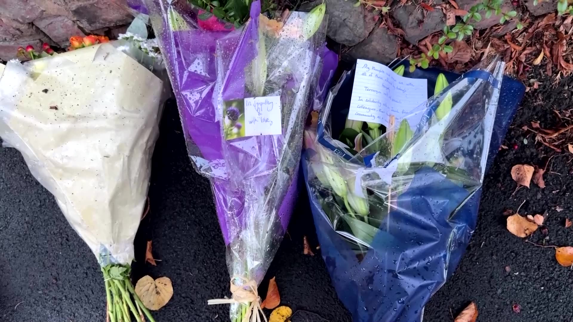 Flowers, notes laid at site of Manchester attack
