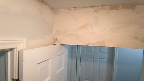Mudding Water Damage Walls in Hall before coat one