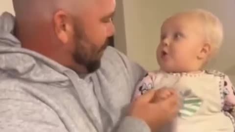 Baby trying to process dad’s new haircut