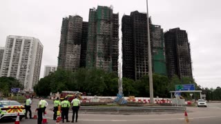 The family tragedy behind the viral photo of the Hong Kong fire