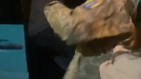 Let the child go! I hate you!” a woman shouts at the draft officers