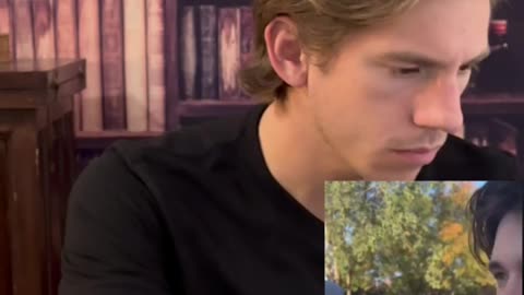 Leftist student knocks down TPUSA chapter signs.