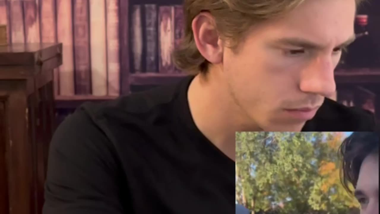 Leftist student knocks down TPUSA chapter signs.