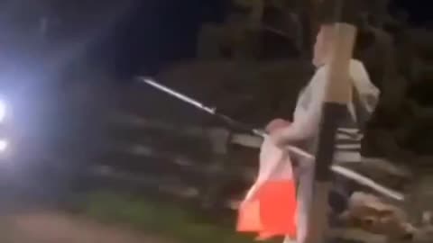 Anti Irish bigot is caught taking down the Irish tri colour.