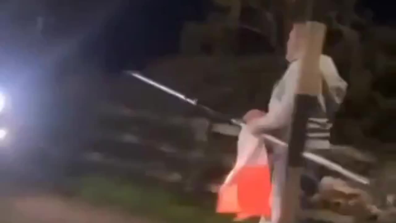 Anti Irish bigot is caught taking down the Irish tri colour.