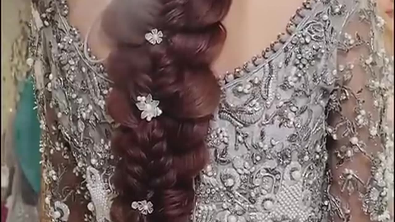 "Elegant Braided Low Chignon: A Timeless Bridal Updo"