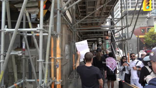 Walking under the enclosed construction tunnel on yonge street (a real industrial look and feel)