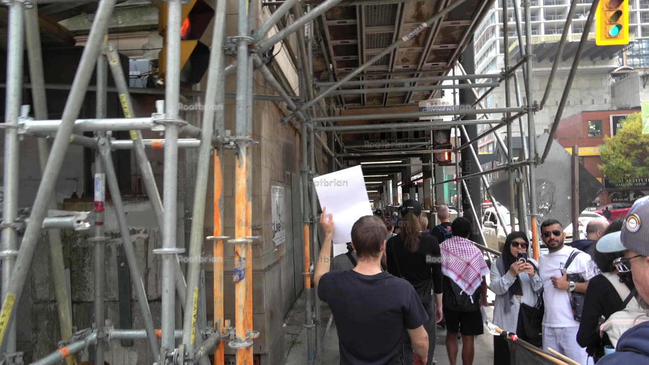Walking under the enclosed construction tunnel on yonge street (a real industrial look and feel)