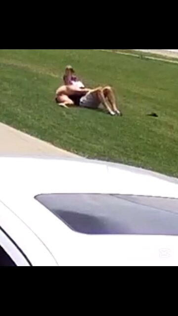 Couple fighting on front lawn