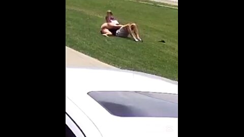 Couple fighting on front lawn