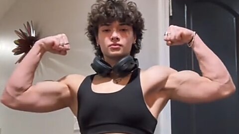 Beautiful muscle girl flexing