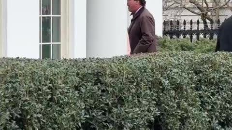 Tucker Carlson entering the White House earlier