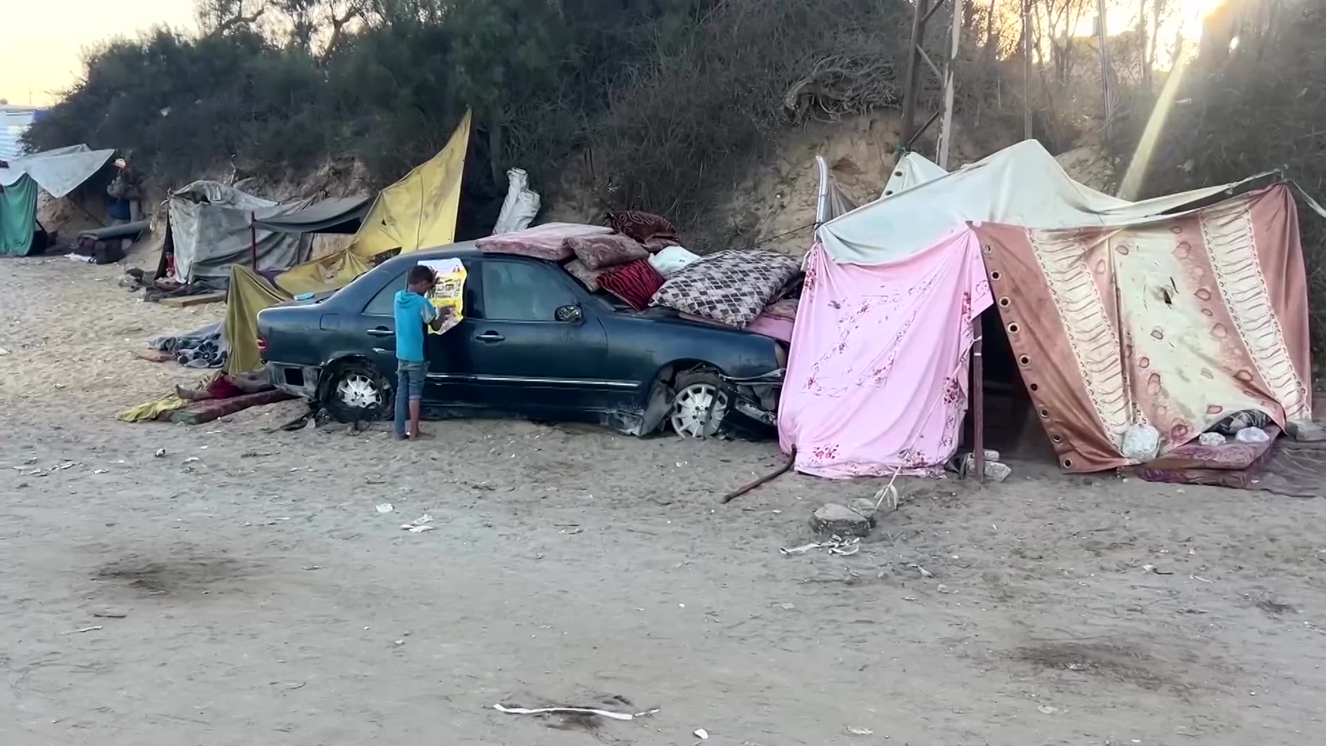 Palestinians shelter by the sea in Central Gaza, others continue south