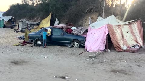 Palestinians shelter by the sea in Central Gaza, others continue south 
