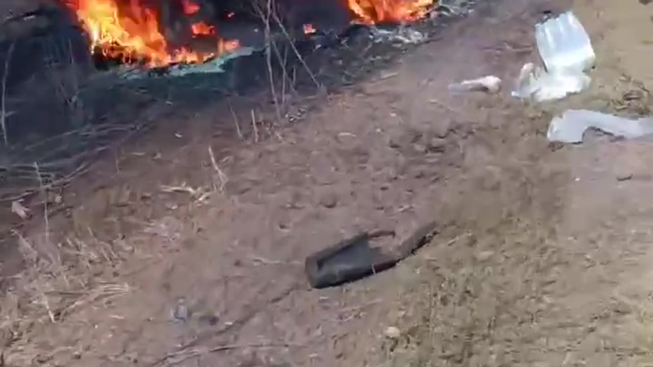 Roadway Lined With Burning Husks of Russian