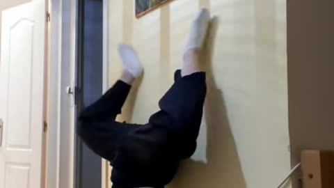 Hand Stand Fail Kicks Painting Off Wall