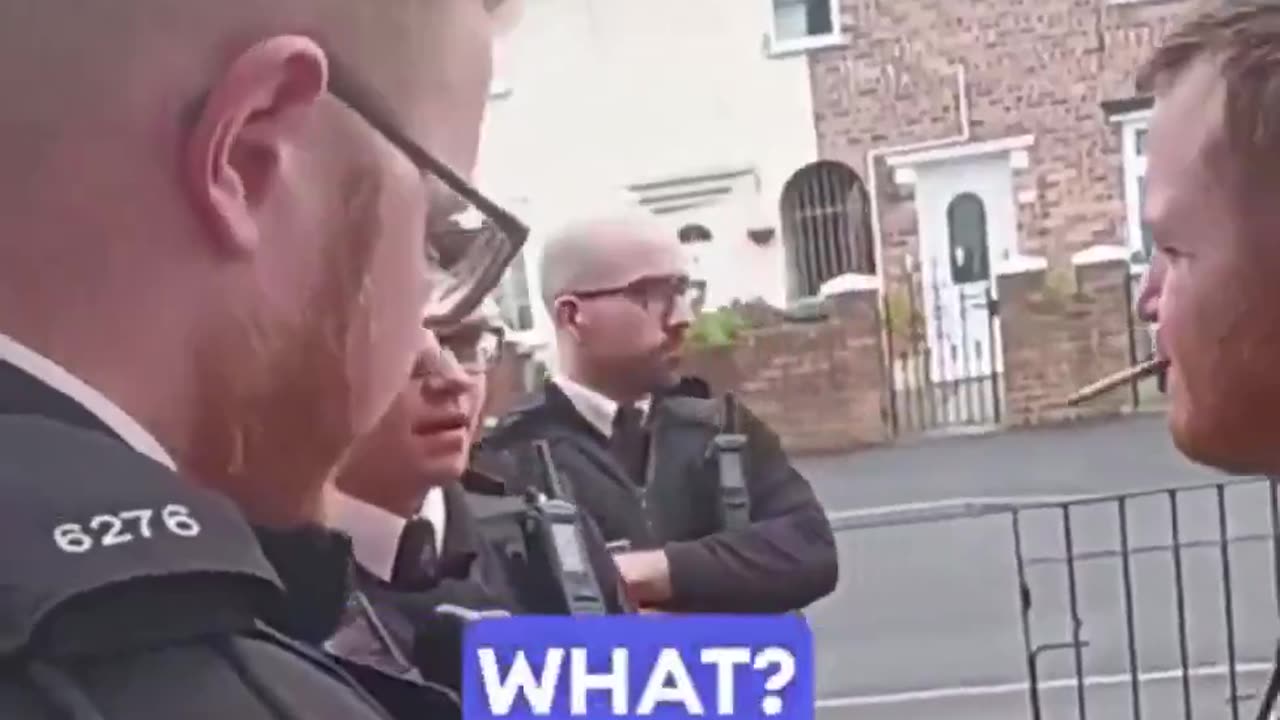 Four British officers go to a man's home to arrest him for his tweets.