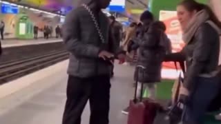 Woman berates migrant at subway station in France