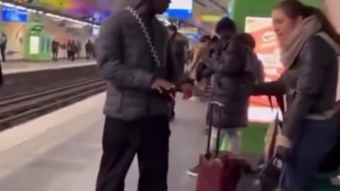 Woman berates migrant at subway station in France