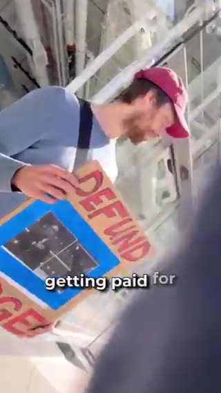 Anti-Elon protester admits he gets paid to protest outside a Tesla location.