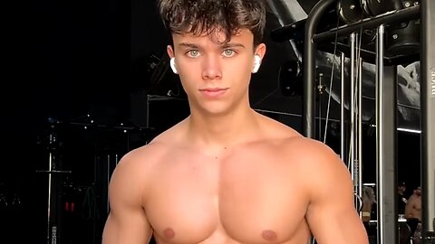 Handsome muscular man showing off his muscles