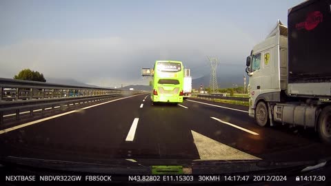 Bus Pins Car Against Median