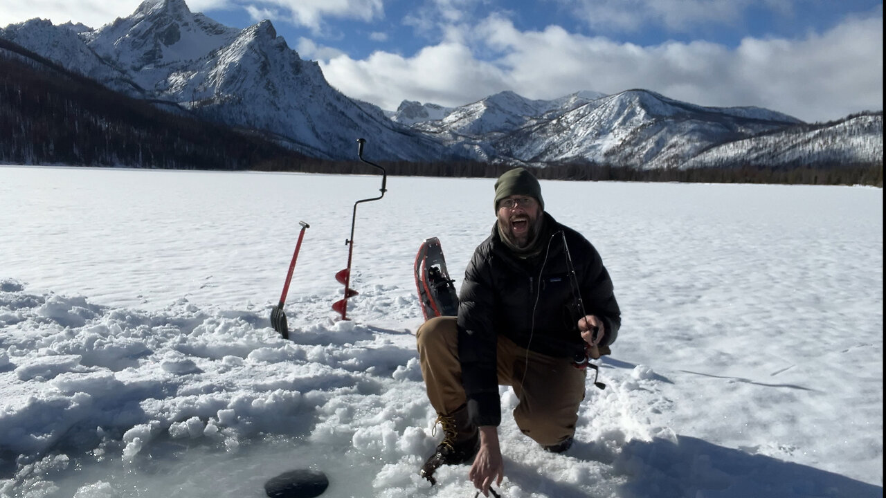 Snowmobile hot tent camping and ice fishing in the Sawtooth Mountains.