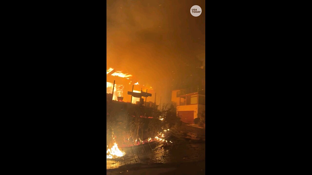 Motorcyclist drives past apocalyptic Los Angel