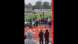 Brawl erupts at youth football game as irate parent charges coach on the field