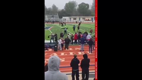 Brawl erupts at youth football game as irate parent charges coach on the field