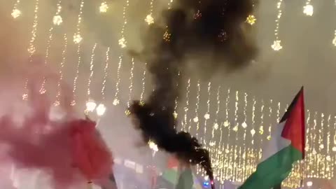 Protesters waving Palestinian flags set off smoke bombs and disrupted the opening night
