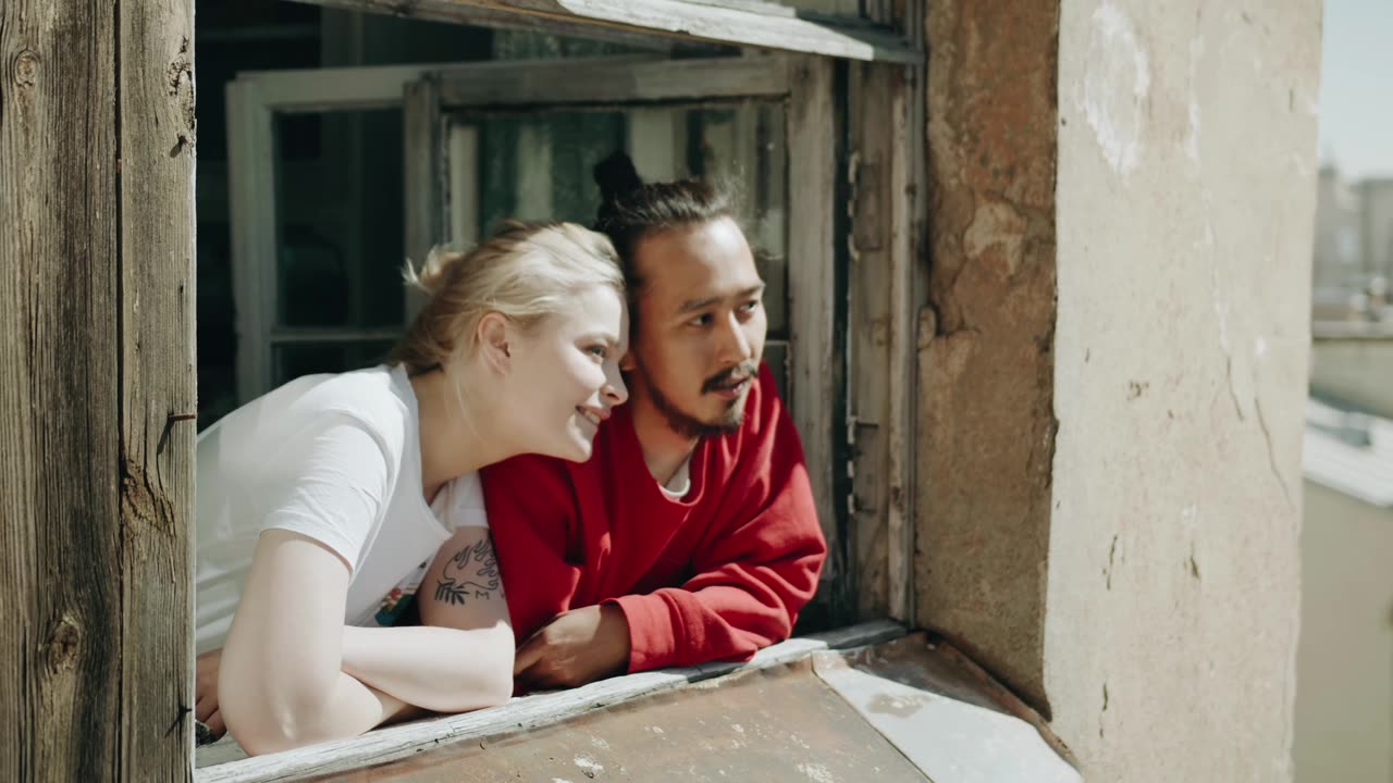 Couple Bonding By Their Home Window