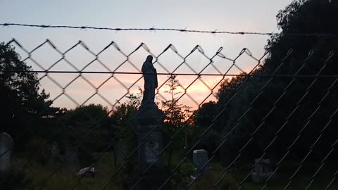 Sunset & the statue of liberty angel