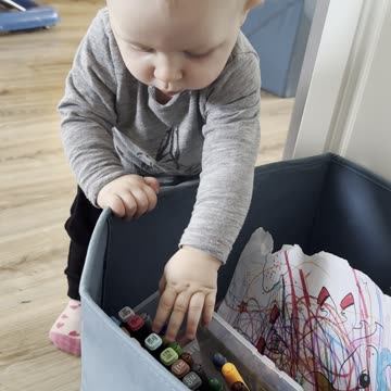 The hunt is on! Baby Kayla is digging into her toy box