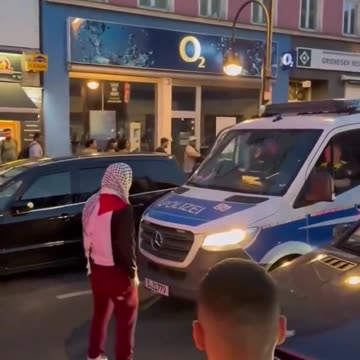 Muslim taunts police officer and tries to open his car door in Germany - cop does nothing