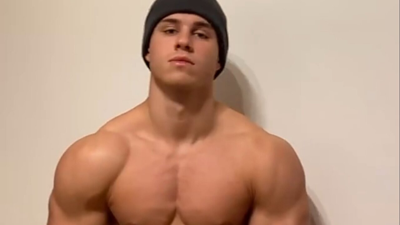 Handsome muscular man flexing muscles