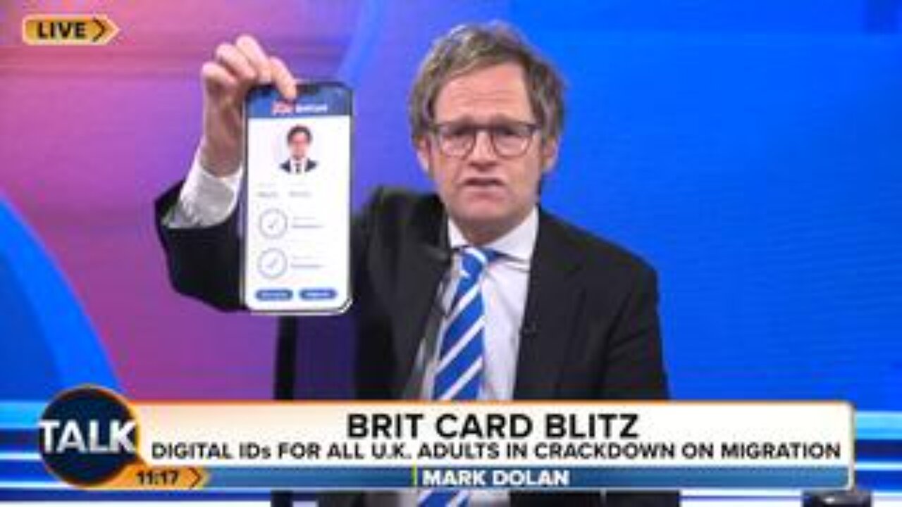 "Here we go again!" Mark Dolan cuts up his "wretched and evil" digital ID card.
