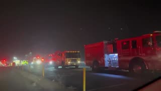 Fire trucks gather at base camp and command post at California Incline on PCH.