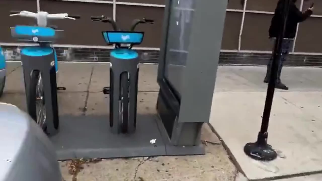 DHS raid a Walgreens in Chicago and outside they are detaining someone when the woman