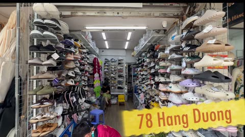 Buying shoes at 78 Hang Duong in Hanoi, Vietnam