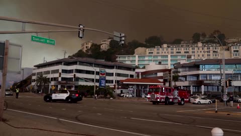 "Let's get out of here": Wildfire burns Los Angeles suburb