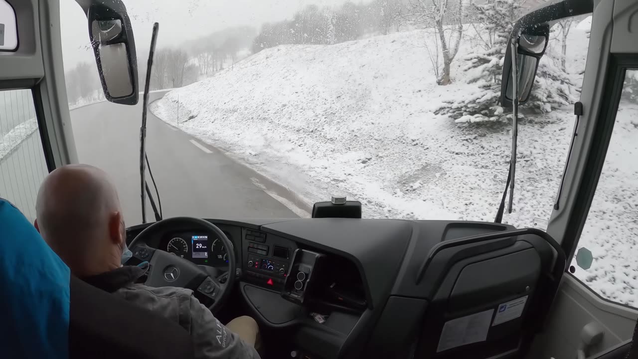 Bus drive in the Alps, snow season, 4K