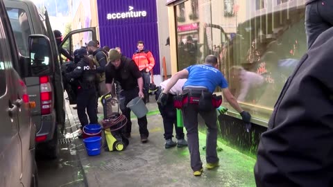 Climate activists smear paint on Amazon House in Davos
