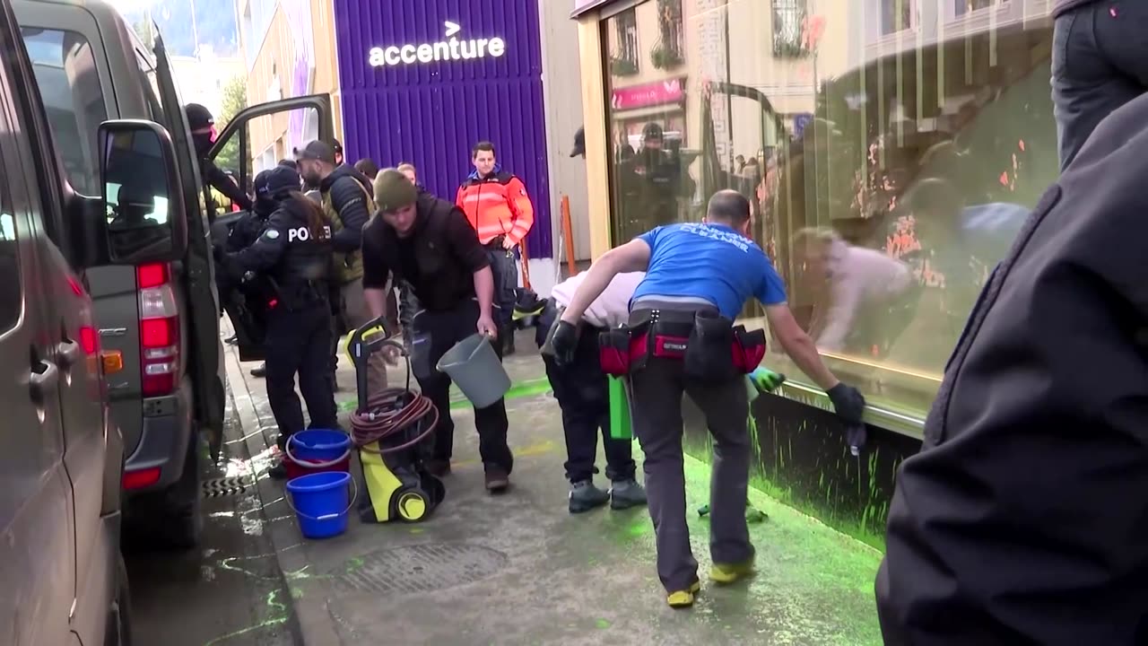 Climate activists smear paint on Amazon House in Davos